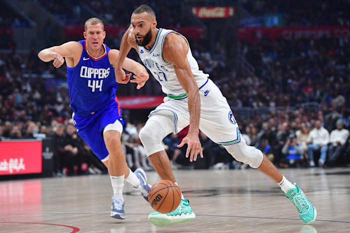 Feb 12, 2024; Los Angeles, California, USA; Minnesota Timberwolves center Rudy Gobert (27) moves to the basket against Los Angeles Clippers center Mason Plumlee (44) during the first half at Crypto.com Arena.