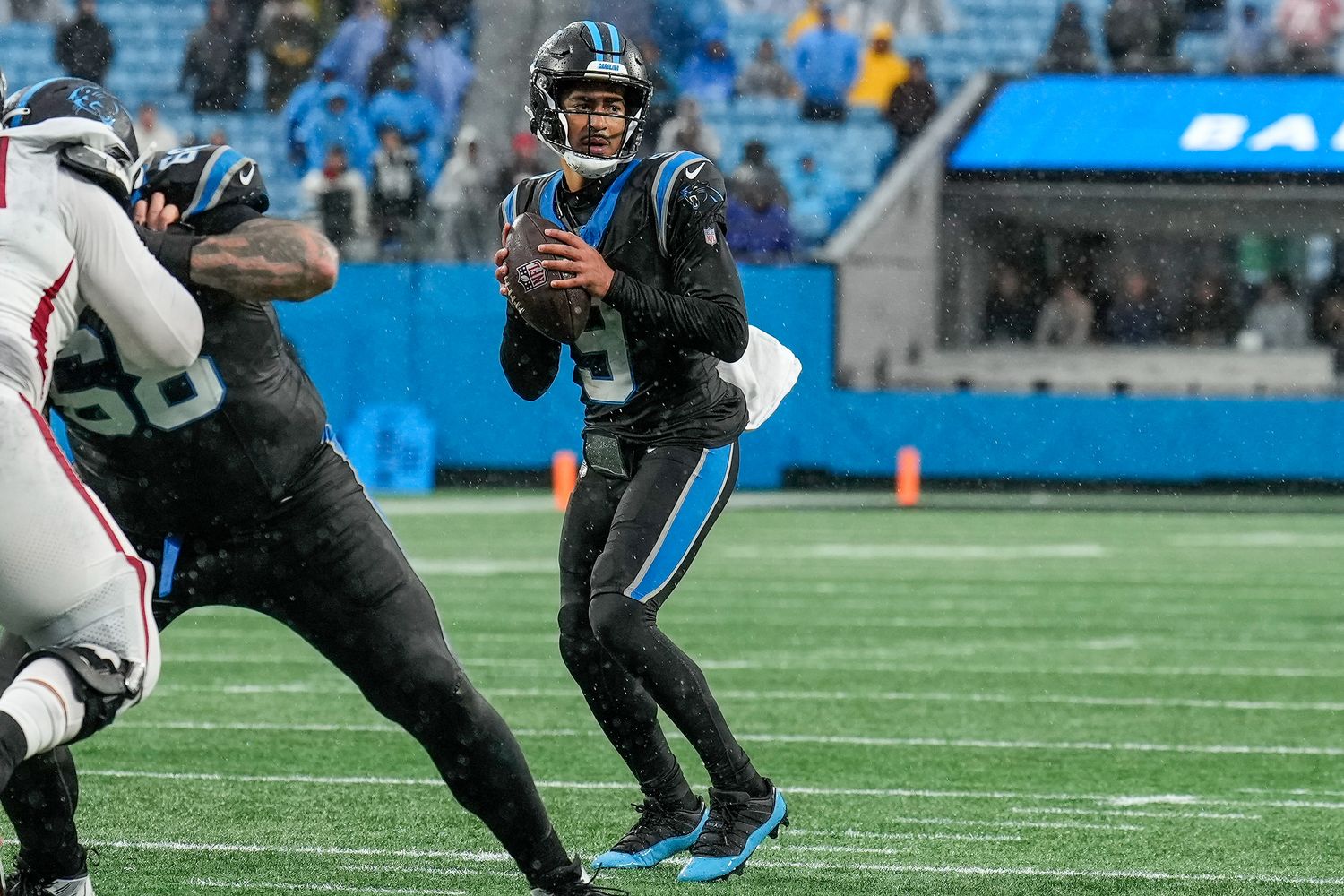 Carolina Panthers quarterback Bryce Young looks for a pass against the Atlanta Falcons.