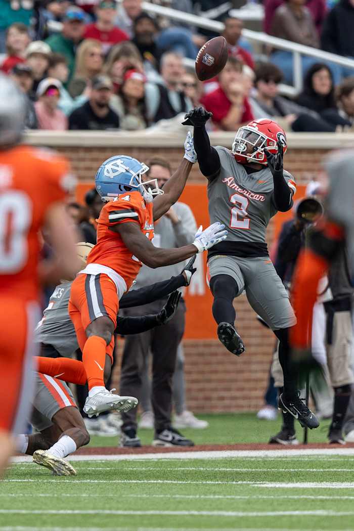 Feb 3, 2024; Mobile, AL, USA; American defensive back Tykee Smith of Georgia (5) deflects a pass from National wide receiver Devontez Walker of North Carolina (14) during the first half of the 2024 Senior Bowl football game at Hancock Whitney Stadium. Mandatory Credit: Vasha Hunt-USA TODAY Sports