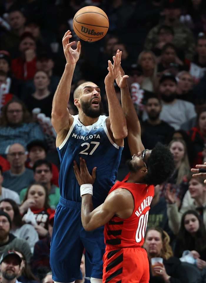 Feb 13, 2024; Portland, Oregon, USA; Minnesota Timberwolves center Rudy Gobert (27) shoots the ball over Portland Trail Blazers guard Scoot Henderson (00) in the third quarter at Moda Center.