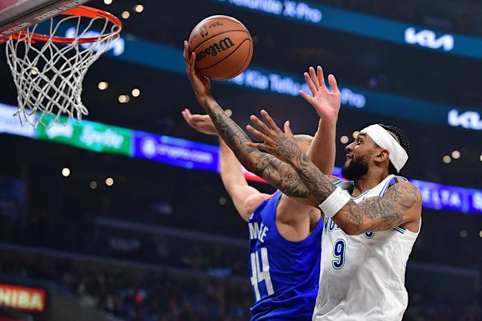 Nickeil Alexander-Walker shoots a layup
