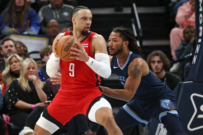 Rockets forward Dillon Brooks (9) spins toward the basket as Memphis Grizzlies guard Derrick Rose (23) defends during the first half at FedExForum.
