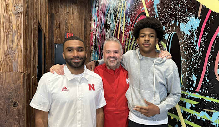 Braylen Prude with Nebraska defensive backs coach Evan Cooper and head coach Matt Rhule.