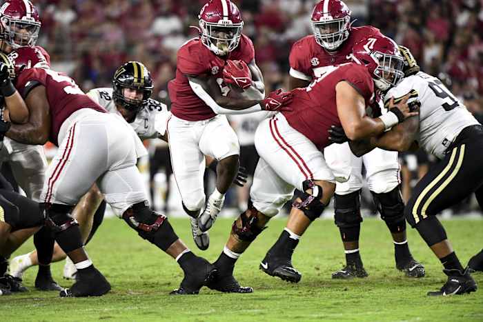 Sep 24, 2022; Tuscaloosa, Alabama, USA; Alabama Crimson Tide running back Roydell Williams (5) runs the ball through a hole opened by offensive lineman Emil Ekiyor Jr. (55) and offensive lineman Darrian Dalcourt (71) agains the Vanderbilt Commodores at Bryant-Denny Stadium. Alabama won 55-3. Mandatory Credit: Gary Cosby Jr.-USA TODAY Sports
