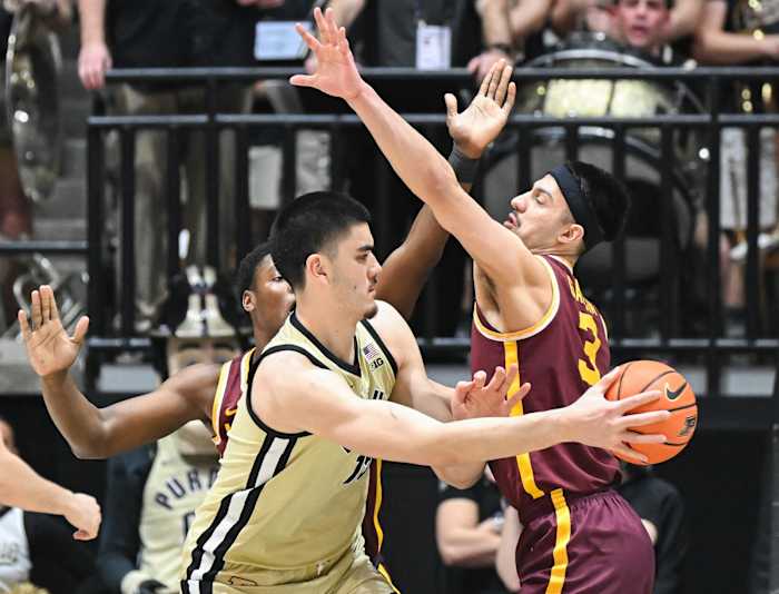 Feb 15, 2024; West Lafayette, Indiana, USA; Purdue Boilermakers center Zach Edey (15) passes the ball around Minnesota Golden Gophers forward Dawson Garcia (3) during the first half at Mackey Arena.