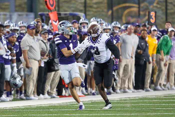 Oct 21, 2023; Manhattan, Kansas, USA; Kansas State Wildcats wide receiver Jayce Brown (1) makes a catch against TCU Horned Frogs safety Mark Perry (3) during the second quarter at Bill Snyder Family Football Stadium. Mandatory Credit: Scott Sewell-USA TODAY Sports