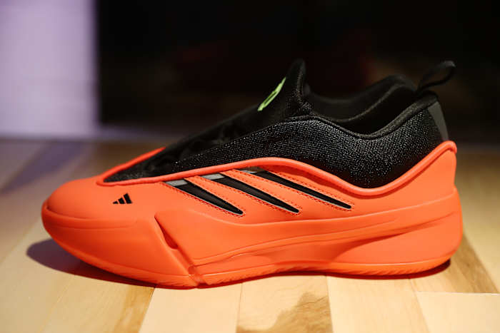 Side view of Damian Lillard's red and black adidas sneaker.