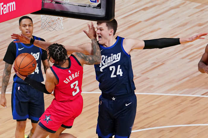 Feb 16, 2024; Indianapolis, Indiana, USA; Team Jalen center Walker Kessler (24) of the Utah Jazz blocks the shot of Team Tamika guard Keyonte George (3) of the Utah Jazz during a Rising Stars semifinal game at Gainbridge Fieldhouse. Mandatory Credit: Kyle Terada-USA TODAY Sports