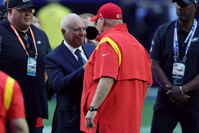 Kansas City Chiefs head coach Andy Reid meets with Philadelphia Eagles owner Jeffrey Lurie on the field before Super Bowl LVII at State Farm Stadium.