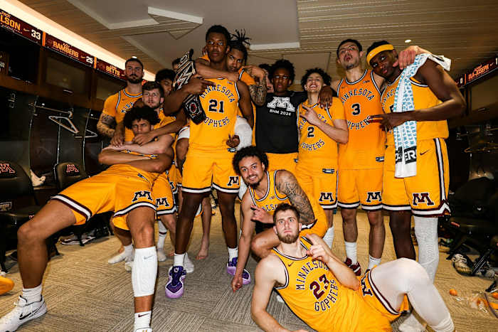 Minnesota poses for a team photo in the locker room after beating Rutgers on Sunday, Feb. 18, 2024.