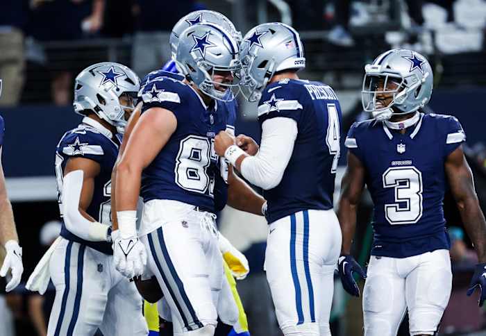 Oct 29, 2023; Arlington, Texas, USA; Dallas Cowboys tight end Jake Ferguson (87) celebrates with Dallas Cowboys quarterback Dak Prescott (4) after catching a touchdown pass during the first quarter against the Los Angeles Rams at AT&T Stadium.