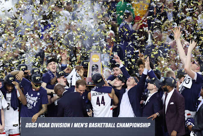 Apr 3, 2023; Houston, TX, USA; Connecticut Huskies players celebrate after defeating the San Diego State Aztecs in the national championship game of the 2023 NCAA Tournament at NRG Stadium. Mandatory Credit: Troy Taormina-USA TODAY Sports