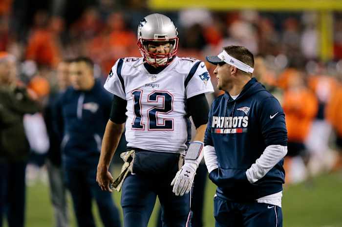 Nov 12, 2017; Denver, CO, USA; New England Patriots quarterback Tom Brady (12) talks with assistant quarterbacks coach Jerry Schuplinski before the game against the Denver Broncos at Sports Authority Field at Mile High.