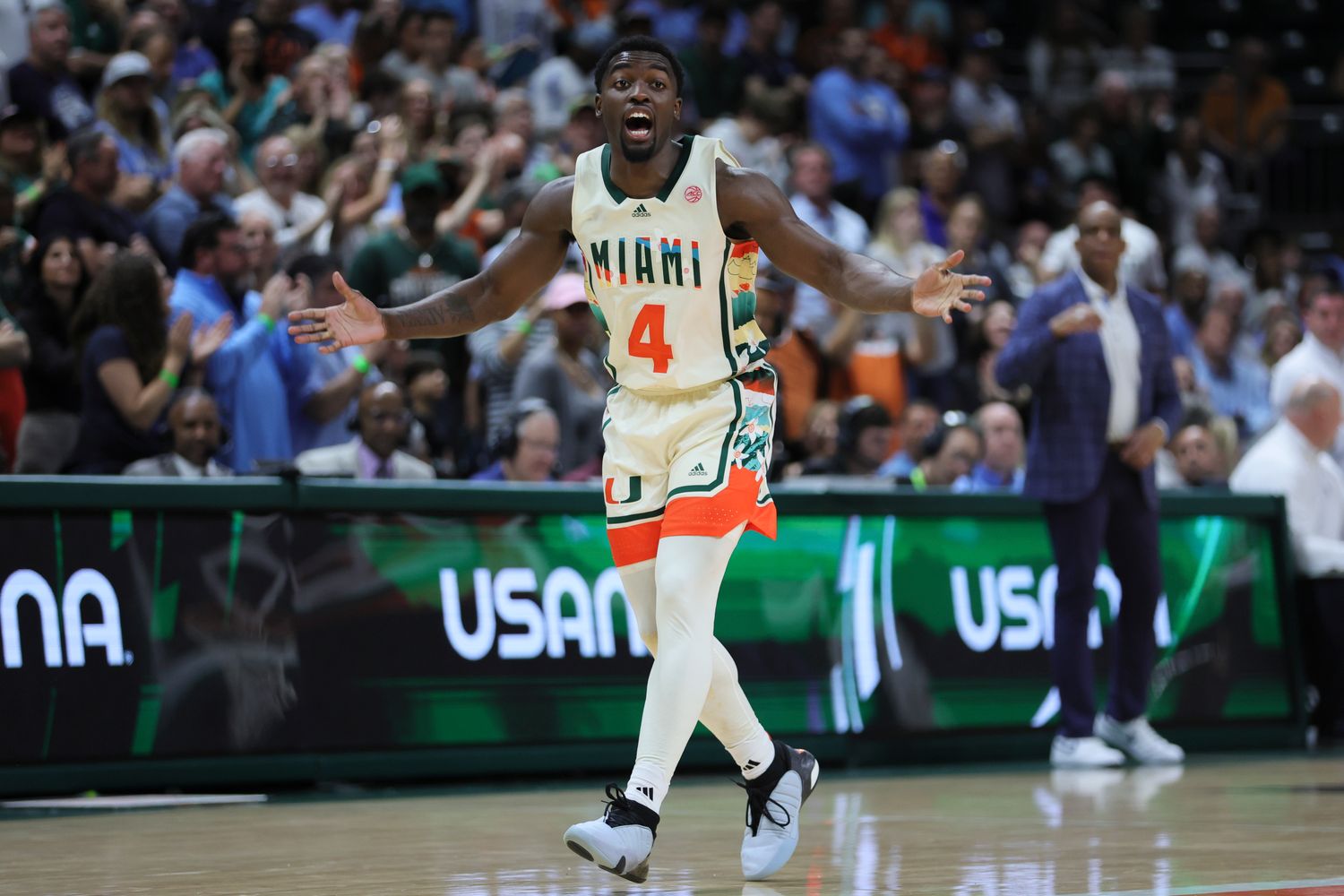 Miami Hurricanes Benslry Johnson argues a call.