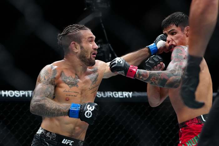 Daniel Zellhuber (red gloves) fights Christos Giagos (blue gloves) during UFC Fight Night at T-Mobile Arena.