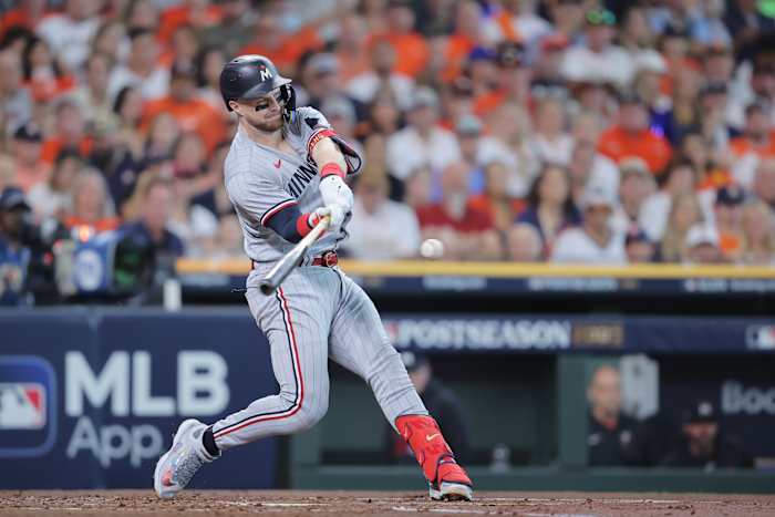 Oct 7, 2023; Houston, Texas, USA; Minnesota Twins catcher Ryan Jeffers (27) hits a single in the second inning against the Houston Astros during game one of the ALDS for the 2023 MLB playoffs at Minute Maid Park.