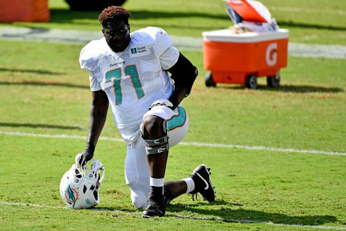 Sep 1, 2020; Miami Gardens, Florida, USA; Miami Dolphins offensive tackle Jonathan Hubbard (71) stretches during training camp at Baptist Health Training Facility. Mandatory Credit: Jasen Vinlove-USA TODAY Sports