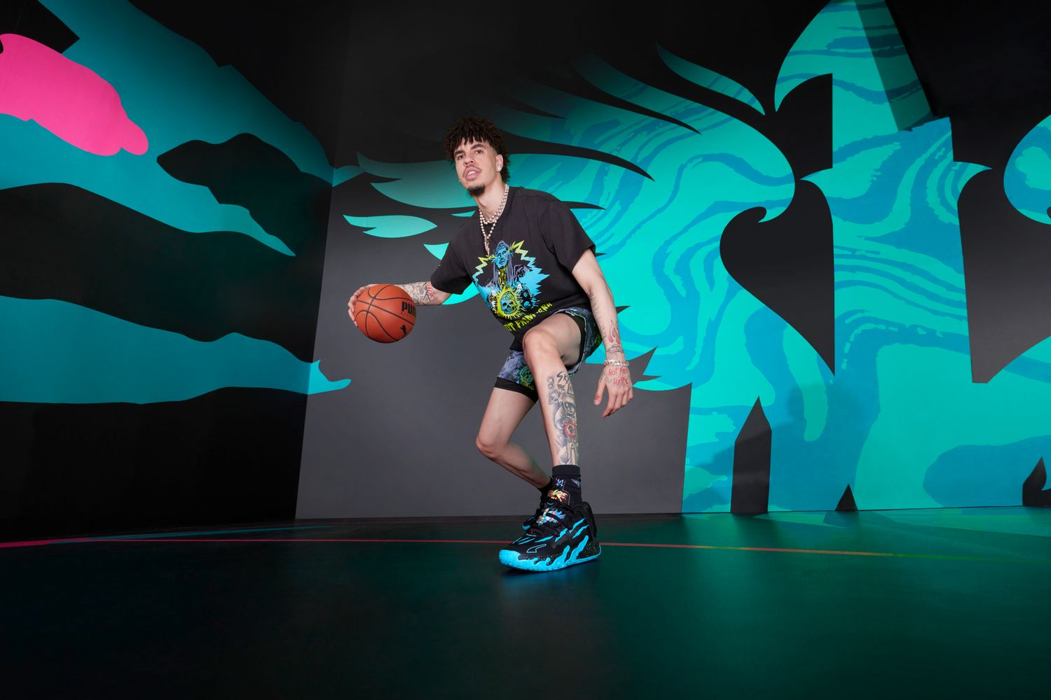 LaMelo Ball models black and blue PUMA apparel.