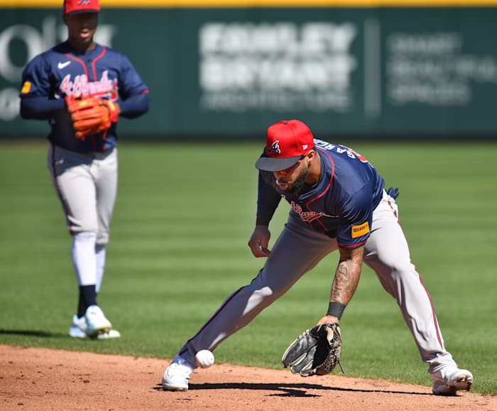 Braves infielder Leury Garcia (#63) scoops up a ground ball during a fielding drill Tuesday, Feb. 20, 2024 at CoolToday Park in North Port, Florida.