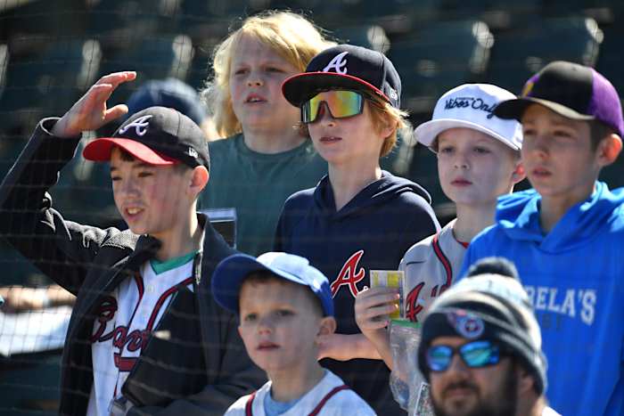 Young baseball fans gather in the stands to watch Atlanta Braves players workout on Tuesday, Feb. 20, 2024 at CoolToday Park in North Port, Florida.