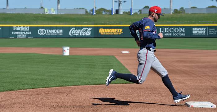 Atlanta Braves outfielder Forrest Wall (#73) steps on first base during a baserunning drill at practice Tuesday, Feb. 20, 2024 at CoolToday Park in North Port, Florida.
