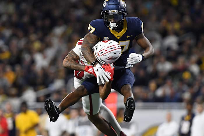 Dec 2, 2023; Detroit, MI, USA; Toledo Rockets cornerback Quinyon Mitchell (27) breaks up a pass intended for Miami (OH) Redhawks wide receiver Gage Larvadain (10) in the third quarter at Ford Field. Mandatory Credit: Lon Horwedel-USA TODAY Sports