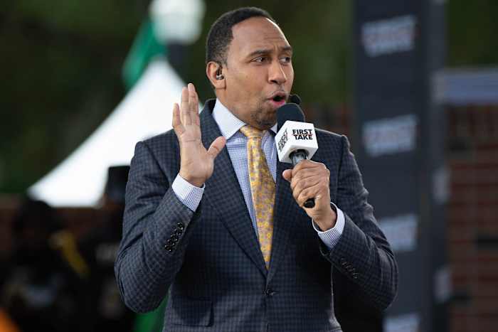 Caption: Sports commentator Stephen A. Smith speaks during a live taping of ESPN's \"First Take\" at Florida A&M University's new Will Packer Performing Arts Amphitheater as part of the school's homecoming festivities Friday, Oct. 29, 2021.