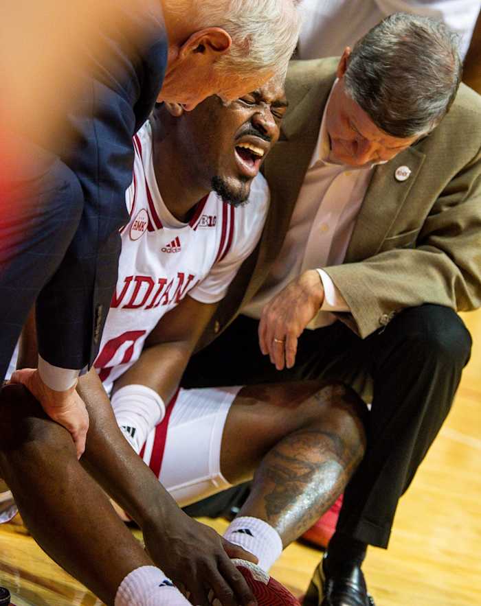 Indiana's Xavier Johnson (0) winces in pain after being injured during the second half of the Indiana versus Iowa men's basketball game at Simon Skjodt Assembly Hall on Tuesday, Jan. 30, 2024. Rich Janzaruk/Herald Times / USA TODAY NETWORK