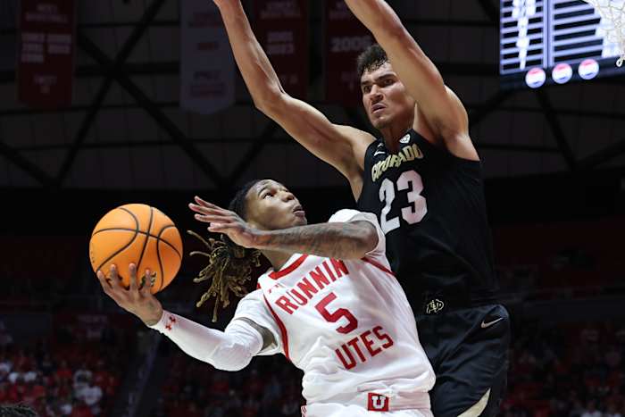 Utah Utes guard Deivon Smith (5) goes to the basket against Colorado Buffaloes forward Tristan da Silva (23) during the second half at Jon M. Huntsman Center