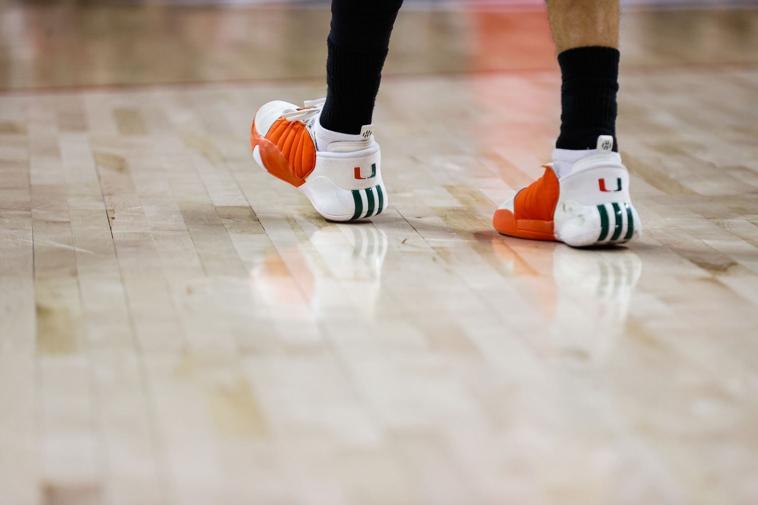 James Harden's white, orange, and green 'Miami Hurricanes' adidas sneakers.