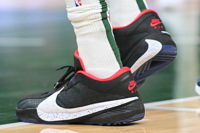 Giannis Antetokounmpo's navy and white 'Uconn Huskies' shoes.