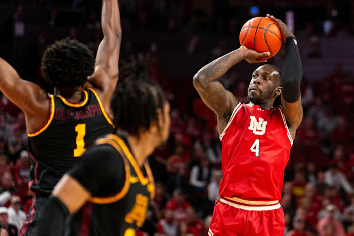 Feb 25, 2024; Lincoln, Nebraska, USA; Nebraska Cornhuskers forward Juwan Gary (4) shoots the ball against Minnesota Golden Gophers forward Joshua Ola-Joseph (1) and guard Elijah Hawkins (0) during the first half at Pinnacle Bank Arena.