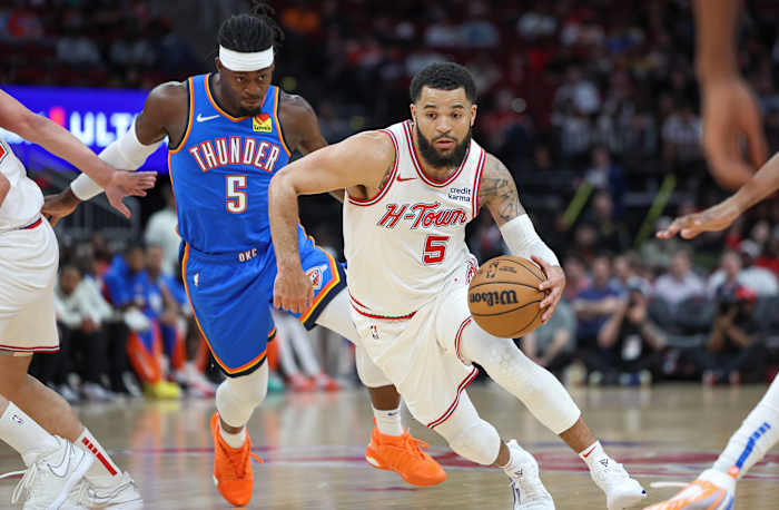 Houston Rockets guard Fred VanVleet (5) drives with the ball as Oklahoma City Thunder guard Luguentz Dort (5) defends during the first quarter at Toyota Center.