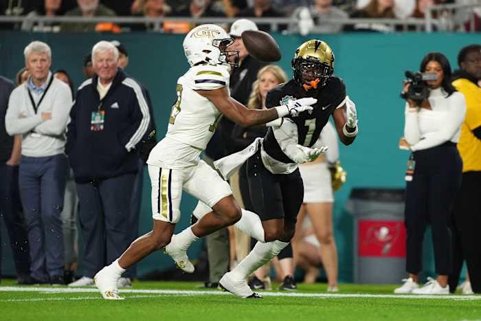 Dec 22, 2023; Tampa, FL, USA; UCF Knights wide receiver Javon Baker (1) catches a pass for a touchdown in front of UCF Knights defensive back Ja'Maric Morris (18) during the first half of the Gasparilla Bowl at Raymond James Stadium.
