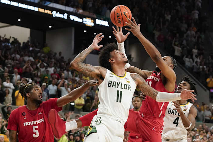 Houston Cougars forward J'Wan Roberts (13) grabs the rebound over Baylor Bears forward Jalen Bridges (11) during the second half at Paul and Alejandra Foster Pavilion.