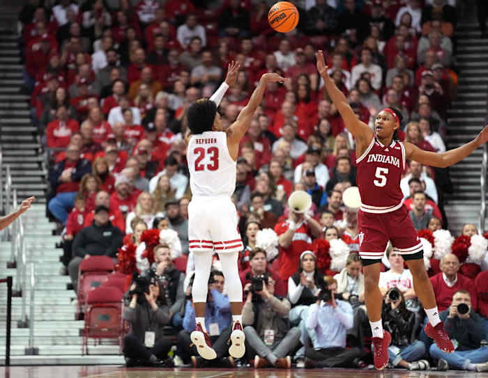 Wisconsin Badgers guard Chucky Hepburn (23) scores a three point basket against Indiana Hoosiers forward Malik Reneau (5) during the first half at the Kohl Center.