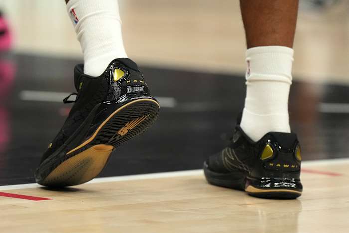 Los Angeles Clippers forward Kawhi Leonard's black and gold New Balance sneakers.