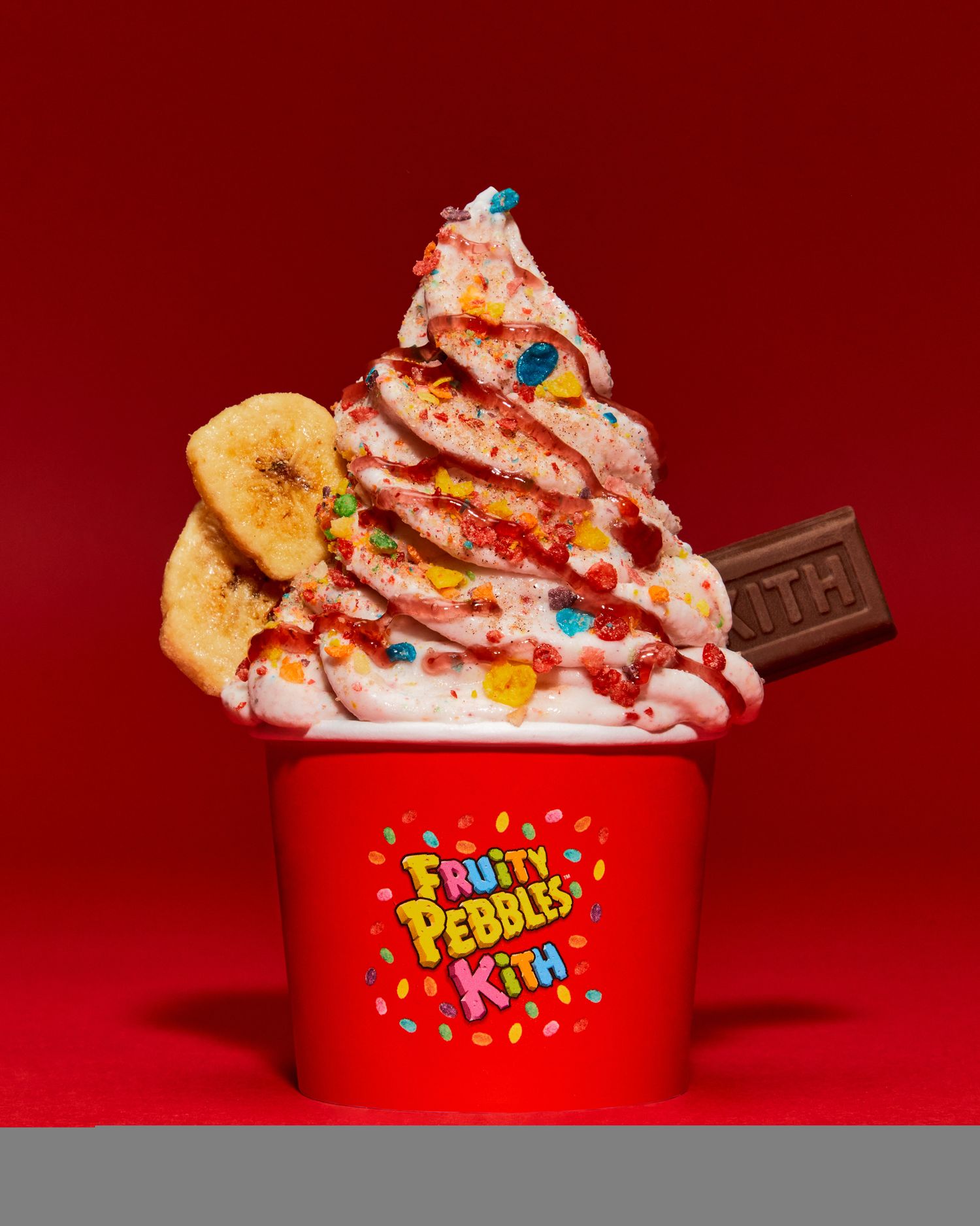 Ice cream topped with Fruity Pebbles cereal.