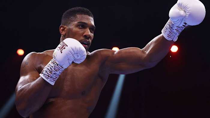 Anthony Joshua taunts during the Heavyweight fight between him and Otto Wallin during the Day of Reckoning in Riyadh, Saudi Arabia. Joshua says he has  agreed to fight Tyson Fury and Deontay Wilder in the past, so he won't back down. RICHARD PELHAM/GETTY IMAGES. 
