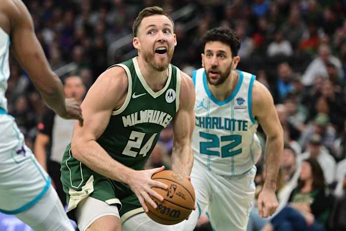 Milwaukee Bucks guard Pat Connaughton (24) looks for a shot against Charlotte Hornets guard Vasilije Micic (22)