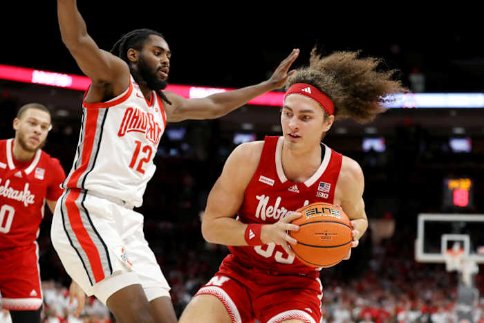 Feb 29, 2024; Columbus, Ohio, USA; Nebraska Cornhuskers forward Josiah Allick (53) moves the ball as Ohio State Buckeyes guard Evan Mahaffey (12) defends during the first half at Value City Arena.