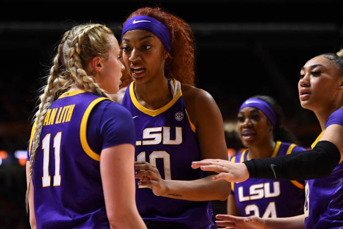 LSU Tigers teammates Angel Reese and Hailey Van Lith talk during a timeout.