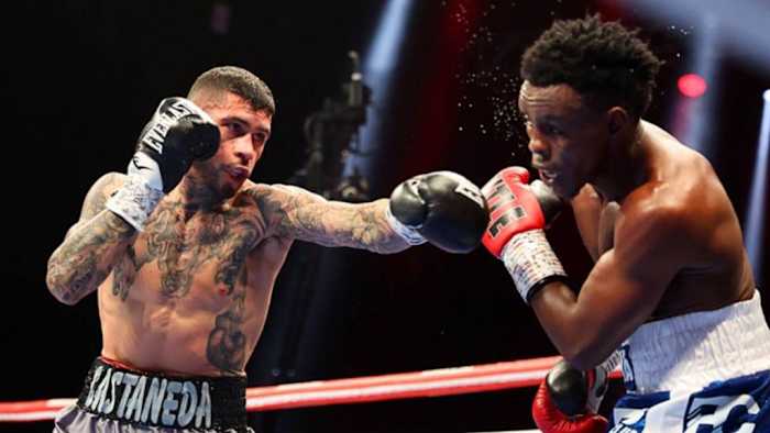 Arnold Barboza Jr. (L) lands a punch on Xolisani Ndongeni (R) at The Theater in Las Vegas, Nevada. Arnold Barboza Jr. claims he is Garcia's backup fighter in the event that Garcia withdraws from the Haney fight. CRIS ESQUEDA/GOLDEN BOY/GETTY IMAGES.