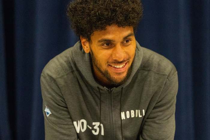 Mar 1, 2024; Indianapolis, IN, USA; Utah wide receiver Devaughn Vele (WO31) talks to the media during the 2024 NFL Combine at Lucas Oil Stadium. Mandatory Credit: Trevor Ruszkowski-USA TODAY Sports