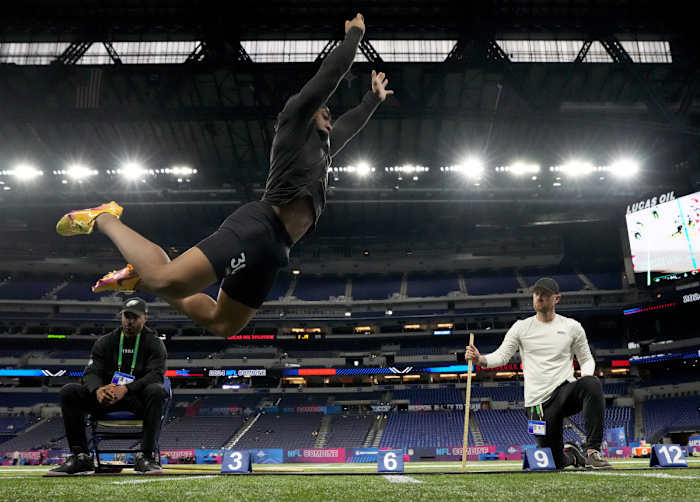 Former Tennessee Volunteers RB Jaylen Wright doing the broad jump at the 2024 NFL Combine. (Photo by Kirby Lee of USA Today Sports)