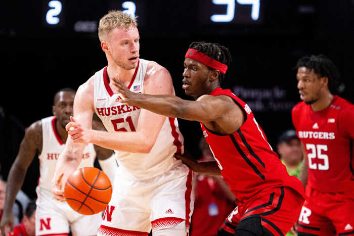Mar 3, 2024; Lincoln, Nebraska, USA; Nebraska Cornhuskers forward Rienk Mast (51) passes against Rutgers Scarlet Knights forward Antwone Woolfolk (13) during the second half at Pinnacle Bank Arena.