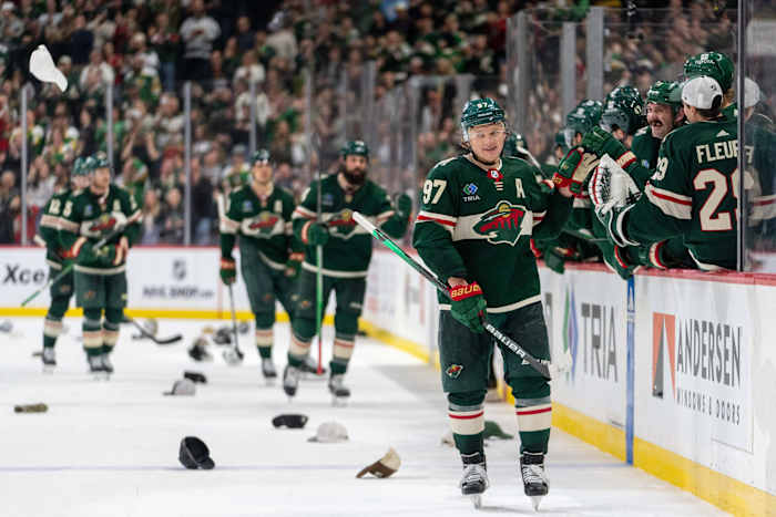 Mar 3, 2024; Saint Paul, Minnesota, USA; Minnesota Wild left wing Kirill Kaprizov (97) celebrates his third goal of the game as hats rain down on the ice in the third period against the San Jose Sharks at Xcel Energy Center.