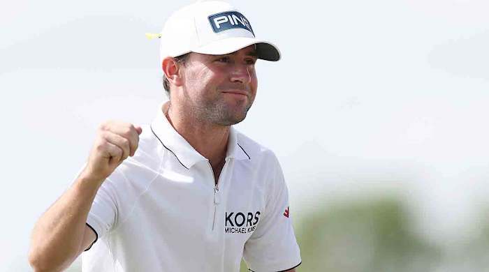 Austin Eckroat celebrates on the 18th green on his way to winning the 2024 Cognizant Classic in The Palm Beaches at PGA National Resort in Palm Beach Gardens, Fla.
