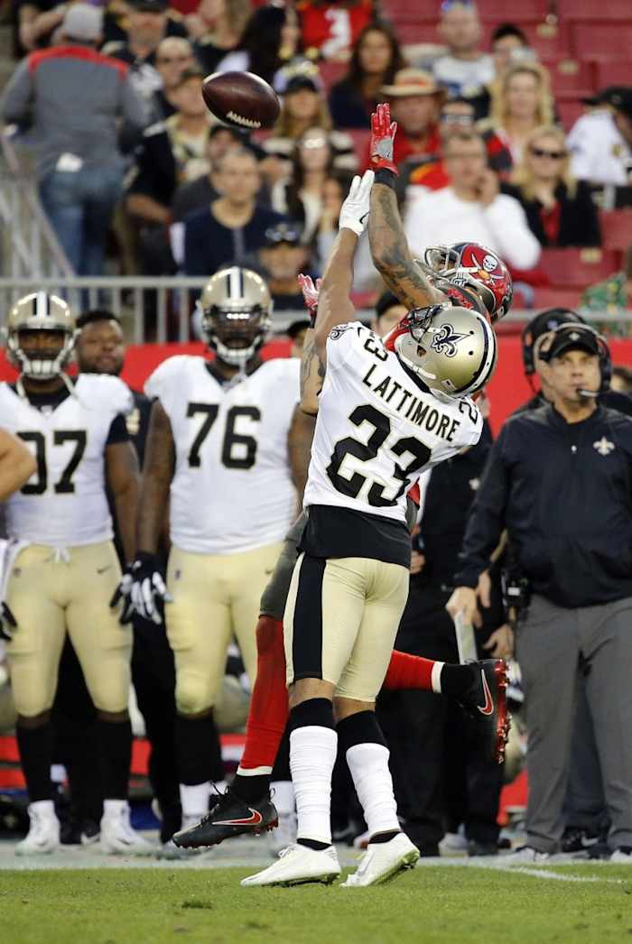 New Orleans Saints cornerback Marshon Lattimore (23) breaks up a pass to Tampa Bay Buccaneers wide receiver Mike Evans (13). Mandatory Credit: Kim Klement-USA TODAY Sports
