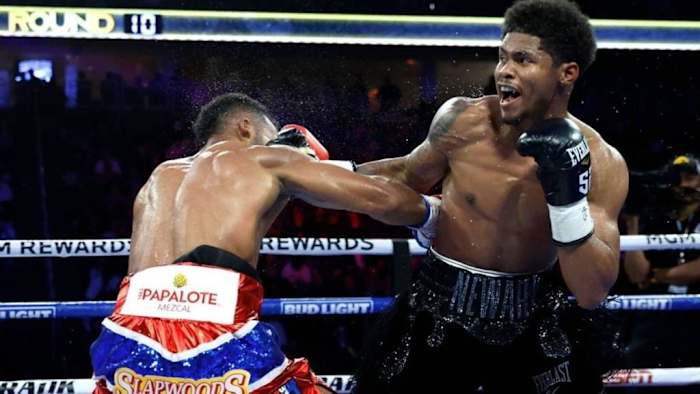 Edwin De Los Santos (L) ducks under a punch by Shakur Stevenson during a fight for a vacant WBC lightweight title in Las Vegas, Nevada. STEVE MARCUS/GETTY IMAGES.